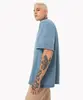 camiseta oversized com bolso manga curta azul PP