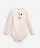 body infantil de algodão manga longa snoopy off white 18-24